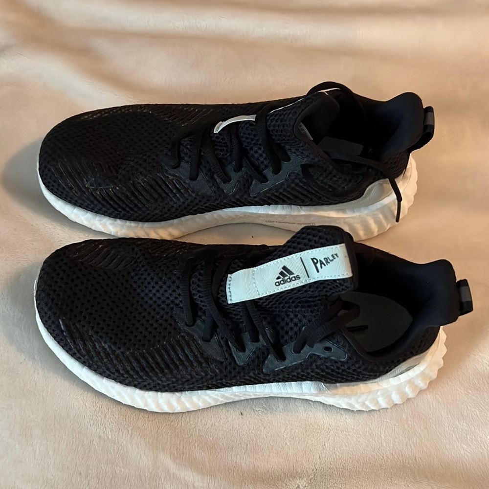 Adidas parley sneakers.  Like new. Worn a couple of times. Women’s size 9.